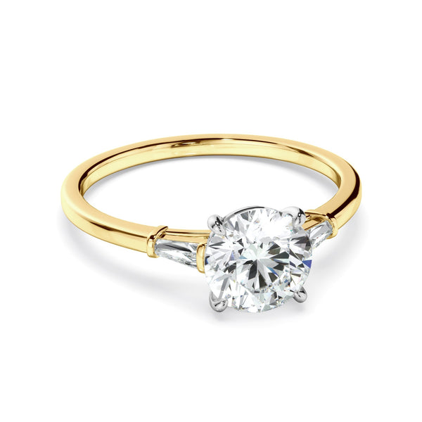 Round Brilliant Cut Diamond Engagement Ring With Baguette Sides