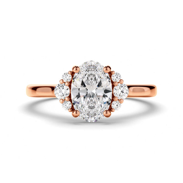 Oval Cut Diamond Engagement Ring with Diamond Cluster Sides