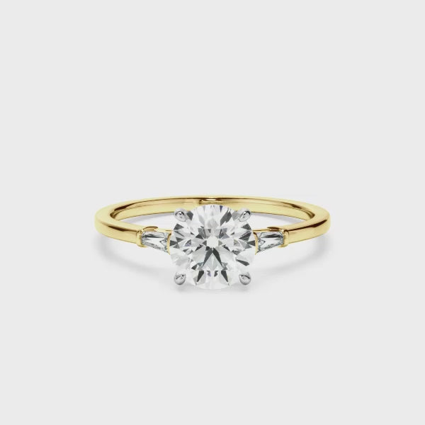 Round Brilliant Cut Diamond Engagement Ring With Baguette Sides