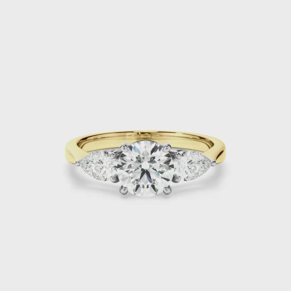 Round Brilliant Cut Diamond Engagement Ring With Pear Cut Diamond Sides