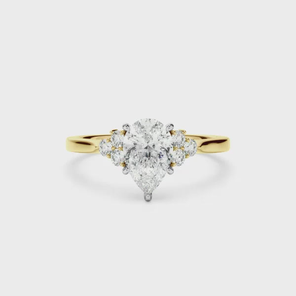 Pear Cut Diamond Engagement Ring With Diamond Cluster Sides