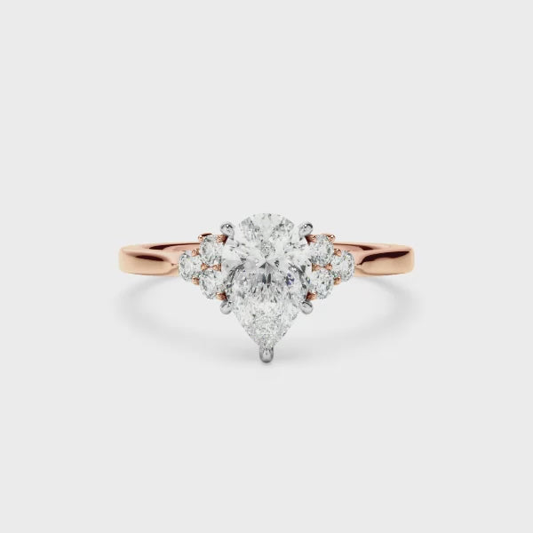 Pear Cut Diamond Engagement Ring With Diamond Cluster Sides