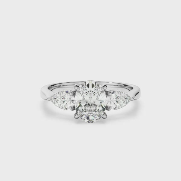 Oval Cut Diamond Engagement Ring With Pear Cut Diamond Sides