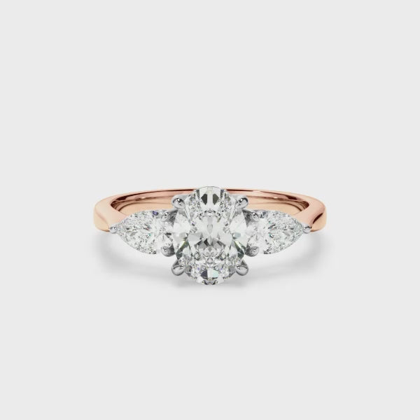 Oval Cut Diamond Engagement Ring With Pear Cut Diamond Sides