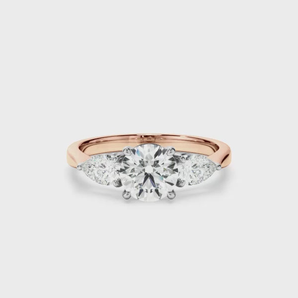 Round Brilliant Cut Diamond Engagement Ring With Pear Cut Diamond Sides